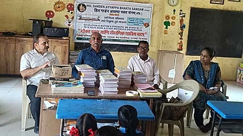 Hill Garden Ayyappa Bhakta Sangham distributed study materials.