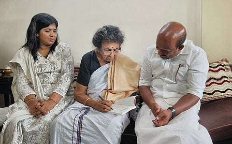 Minister M. Liju visits Leela Sarkkar.