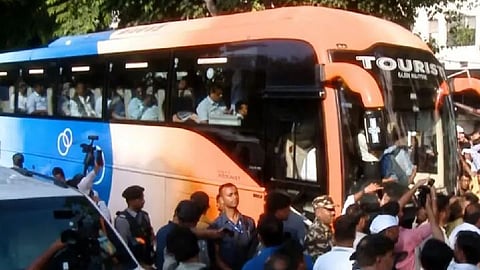 A bus carrying opposition MPs to Jantar Mantar.