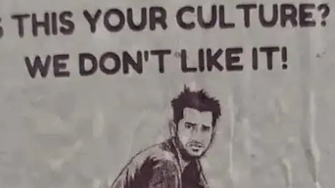 racist stickers showing public defecation targeting indians australia