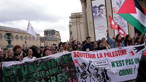 French student rioters waving foreign flags