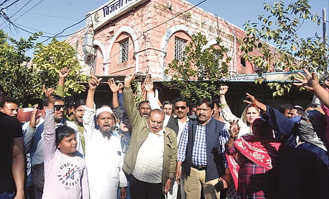 Congress workers along with residents demonstrate in front of the office of the
Madhya Pradesh Electricity Board after officials removed a transformer from
a pole to disconnect supply lines