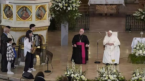 Pope visits refugees, urges Hungary to show charity to all