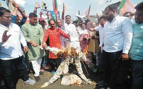 BJP activists burn an effigy of leader of the opposition in the state assembly Govind Singh against his alleged controversial remarks on Rani Kamlapati, in Bhopal on Sunday.