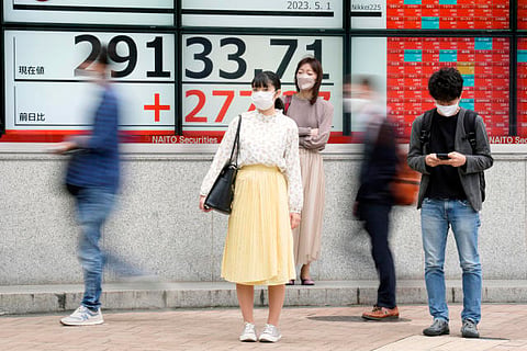 Stock market today: Tokyo gains, most world markets closed