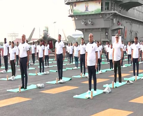 Rajnath Singh participates yoga celebrations on board INS Vikrant