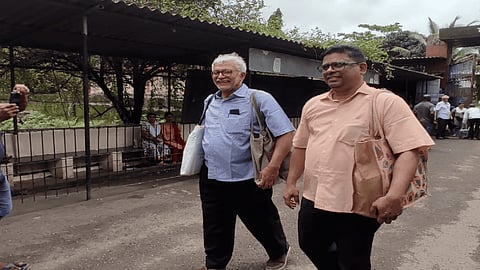 Activists Arun Ferriera and Arun Gonsalves walking out of jail.