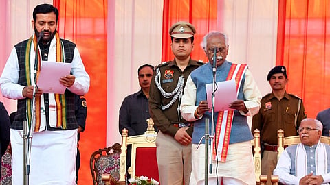 Haryana Governor Bandaru Dattatreya administers the oath to BJP leader Nayab Singh Saini as chief minister of Haryana, at Raj Bhavan in Chandigarh, Tuesday, March 12, 2024.