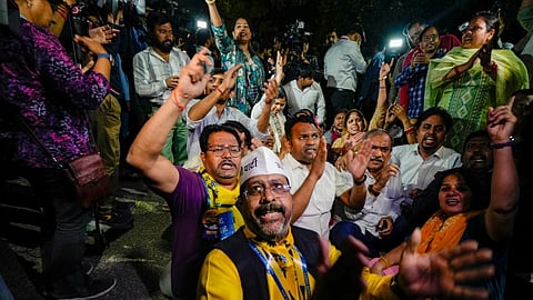 AAP supporters shout slogans in favour of Delhi Chief Minister Arvind Kejriwal outside his residence, in New Delhi, Thursday, March 21, 2024. An ED team has reached Kejriwal's residence Thursday evening, after the Delhi High Court refused to grant him protection from coercive action in an excise policy-linked money laundering case.