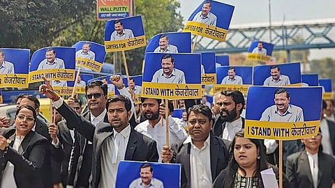 AAP's legal cell members protest against the arrest of Delhi Chief Minister Arvind Kejriwal, outside the Tis Hazari Court in New Delhi, Wednesday, March 27, 2024.