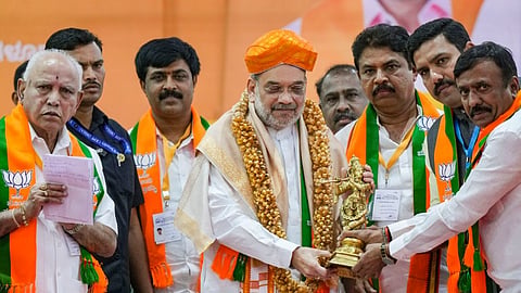 Union Home Minister Amit Shah with BJP leader B.S. Yediyurappa during a meeting ahead of Lok Sabha elections, in Bengaluru, Tuesday, April 2, 2024.