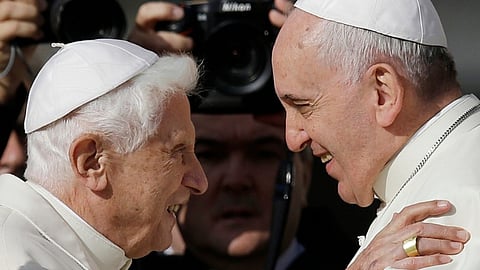 Pope emeritus Benedict XVI with Pope Francis.
