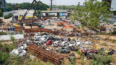 Wreckage of the vehicles that were damaged after a 100-foot tall illegal billboard fell on a petrol pump due to rains and dust storm, in Ghatkopar area of Mumbai.