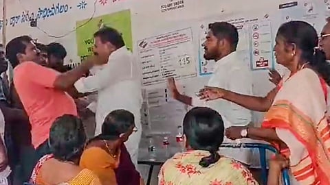 YSRCP leader A Sivakumar and a voter clash during voting for the fourth phase of Lok Sabha elections and Andhra Pradesh State Assembly elections, at a polling booth, in Guntur, Andhra Pradesh, Monday, May 13, 2024.