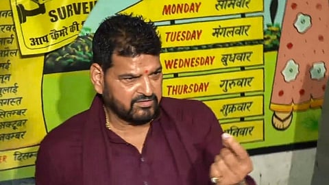 BJP leader Brij Bhushan Sharan Singh shows his inked finger after casting his vote for the fifth phase of Lok Sabha elections, in Gonda, Monday, May 20, 2024.