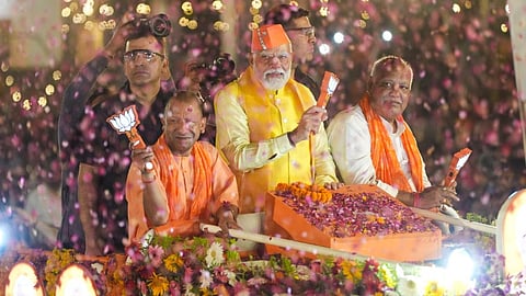 Prime Minister Narendra Modi with Uttar Pradesh Chief Minister Yogi Adityanath during a roadshow for Lok Sabha elections, in Ayodhya, Sunday, May 5, 2024.