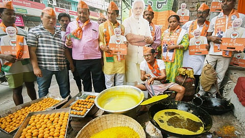 BJP supporters prepare sweets on the eve of the results of Lok Sabha elections, in Patna, Monday, June 3, 2024.