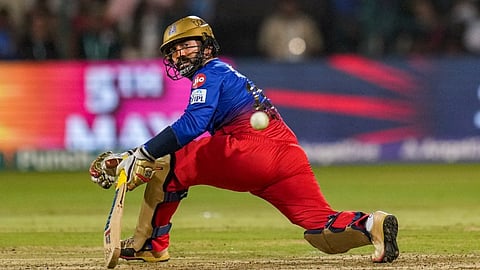 Royal Challengers Bengaluru batter Dinesh Karthik plays a shot during the Indian Premier League (IPL) 2024 cricket match between Royal Challengers Bengaluru and Chennai Super Kings, at M Chinnaswamy Stadium in Bengaluru, Saturday, May 18, 2024.