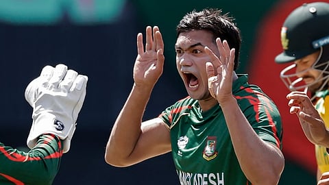 Bangladesh's Taskin Ahmed celebrates the dismissal of South Africa's captain Aiden Markram, partly seen on right, during the ICC Men's T20 World Cup cricket match between Bangladesh and South Africa at the Nassau County International Cricket Stadium in Westbury, New York, Monday, June 10, 2024.