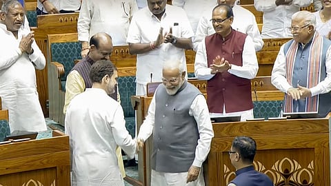 Leader of the Opposition Rahul Gandhi shakes hands with Prime Minister Narendra Modi after Om Birla was elected as the Speaker of the House during the first session of the 18th Lok Sabha, in New Delhi, Wednesday, June 26, 2024.