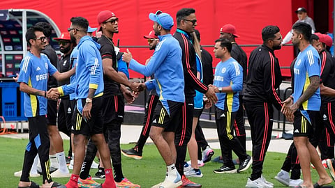 Players of the two teams greet each other after the ICC Men's T20 World Cup cricket match between Canada and India was called off due to wet outfield at the Central Broward Regional Park Stadium, Lauderhill, Fla., Saturday, June 15, 2024.