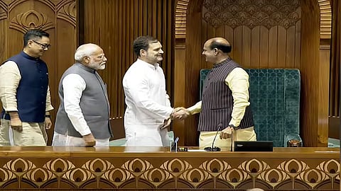 Lok Sabha speaker Om Birla is being congratulated by Rahul Gandhi