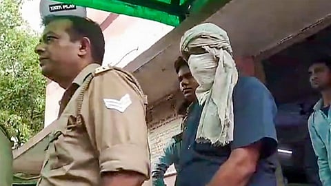 Prime accused of the Hathras stampede case, Devprakash Madhukar, being brought by police to a hospital for medical examination, in Hathras, Saturday, July 6, 2024.