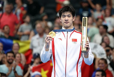 Pan Zhanle of China broke his own world record on the way to winning the men's 100-meter freestyle Wednesday night