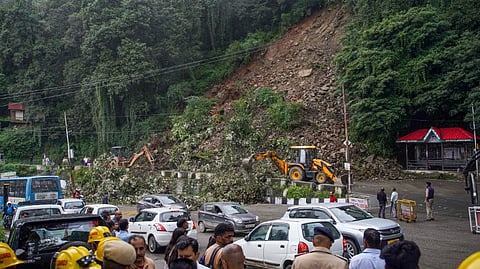 Excavators being used to clear debris from a road after a landslide following heavy monsoon rains, in Shimla, Monday, Aug. 19, 2024.