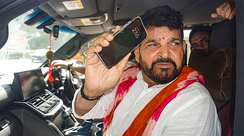 Former Wrestling Federation of India (WFI) chief and BJP leader Brij Bhushan Sharan Singh leaves the Rouse Avenue Court after the Court framed charges against him in an alleged sexual harassment case lodged by female wrestlers, in New Delhi, Tuesday, May 21, 2024.