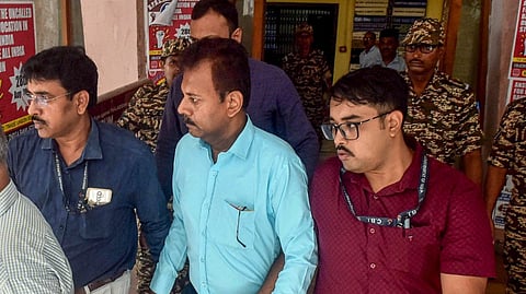 CBI officials take Ex-RG Kar College principal Sandip Ghosh, in blue shirt, to the court, in Kolkata, Tuesday. Sept. 10 ,2024.