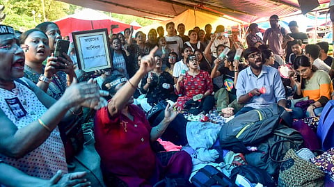 Doctors stage a 'dharna' against the alleged rape and killing of a trainee doctor, in Kolkata, Saturday, Sept. 14, 2024.