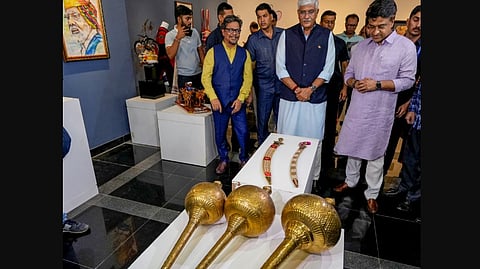 Union Minister of Culture and Tourism Gajendra Singh Shekhawat views Prime Minister's mementos displayed at National Modern Art Gallery, in New Delhi, Monday, Sept. 16, 2024.