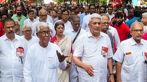 CPI (M) politburo members Prakash Karat, Biman Bose, Brinda Karat, former Tripura chief minister Manik Sarkar and others march during the last journey of late party leader Sitaram Yechury from the party headquarters to the AIIMS hospital, in New Delhi, Saturday, Sept. 14, 2024.