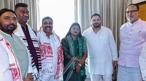 RJD leader Tejashwi Yadav with party leaders during a meeting, in Ranchi, Saturday, Oct. 19, 2024.