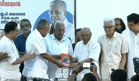 Pinarayi Vijayan releases P Jayarajan's book on Muslim Politics in Kerala, by handing over a copy to CPIM veteran Paloli Muhammed Kutty in Kozhikode.