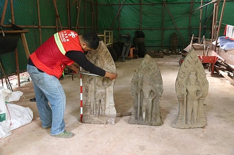 Cambodian archaeologists discover dozen centuries-old sandstone statues at Angkor UNESCO site
