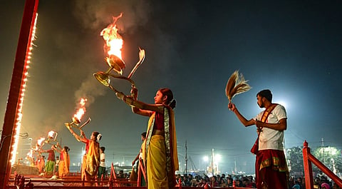 'Mahila Batuk' along with priests perfom Ganga Arti on the first day of new year, at Sangam in Prayagraj, Uttar Pradesh, Wednesday, Jan. 1, 2025.