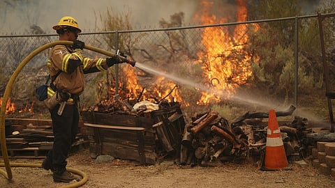 Firefighters battle to maintain the upper hand on a huge fire north of Los Angeles