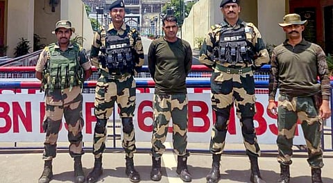Purnam Kumar Shaw, centre, with other BSF jawans after he was handed over by Pak Rangers via Attari-Wagah border in Punjab, Wednesday, May 14, 2025.
