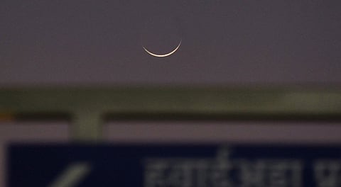 The crescent moon rises, ahead of the Eid-ul-Adha festival, in Patna, Wednesday, May 28, 2025.