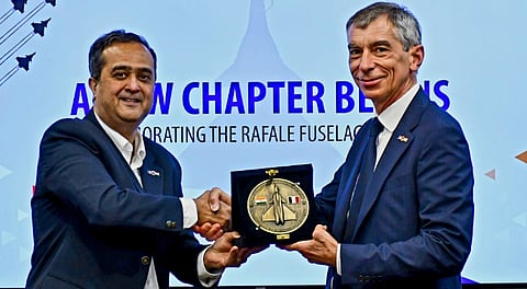 Officials during the signing of four Production Transfer Agreements between Dassault Aviation and Tata Advanced Systems Limited to manufacture Rafale fighter aircraft fuselage components in India.