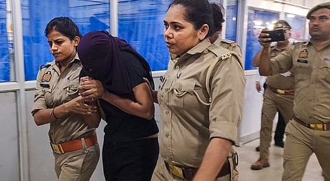 Sonam Raghuvanshi, the Indore woman accused of plotting her husband's murder during their honeymoon in Meghalaya, being brought for medical examination at a hospital, in Ghazipur, Monday, June 9, 2025.