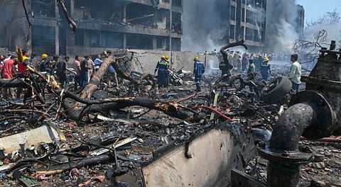 Fire and Emergency Services personnel at work following the Air India plane crash in Ahmedabad, Thursday, June 12, 2025.