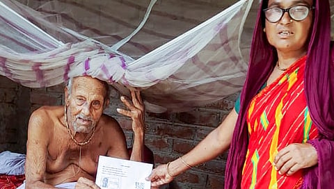 A post on X on June 29, 2025 shows an elderly voter being given the enumeration form by a Booth Level Officer (BLO) during the ongoing special intensive revision of electoral rolls in Bihar, in Madhubani