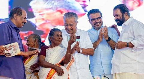 Kerala Chief Minister Pinarayi Vijayan interacts with 76-year old Sarada Kani and 75-year old Vishalakshi, both of whom underwent training as part of the 'Digi Kerala project', during an event where the state was declared as the first fully digitally literate State in India, in Thiruvananthapuram, Thursday, Aug. 21, 2025.