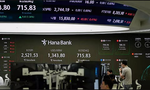 Asian benchmarks mixed after Wall Street edges down from record highs