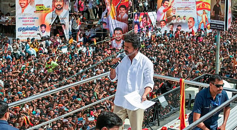 amilaga Vettri Kazhagam (TVK) chief and actor Vijay greets supporters during a rally, in Namakkal, Tamil Nadu, Saturday, Sept. 27, 2025.