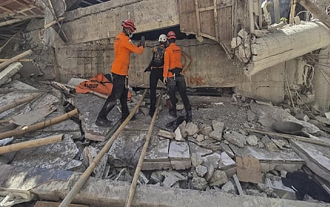 Indonesian rescuers search for missing students after school collapse kills 40