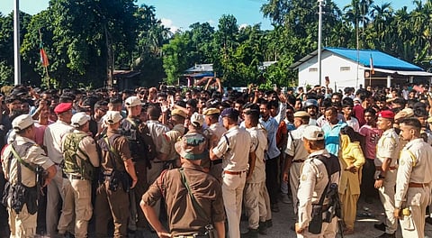 Police personnel try to contain protestors as five accused arrested in cultural icon Zubeen Garg's death case were being brought to the Central Jail, in Baksa, Assam, Wednesday, Oct. 15, 2025.
